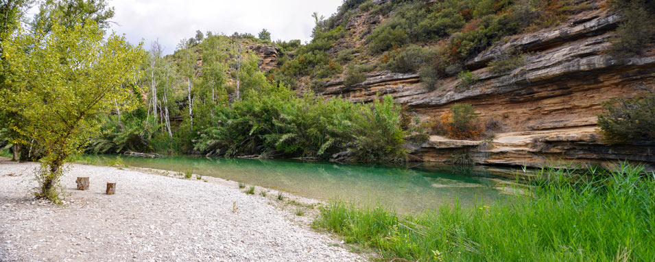 wild swimming in fluvial beach in Huesca